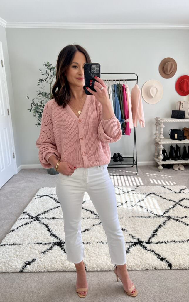 Nashville wardrobe stylist wearing white jeans and a pink sweater to transition wardrobe to spring